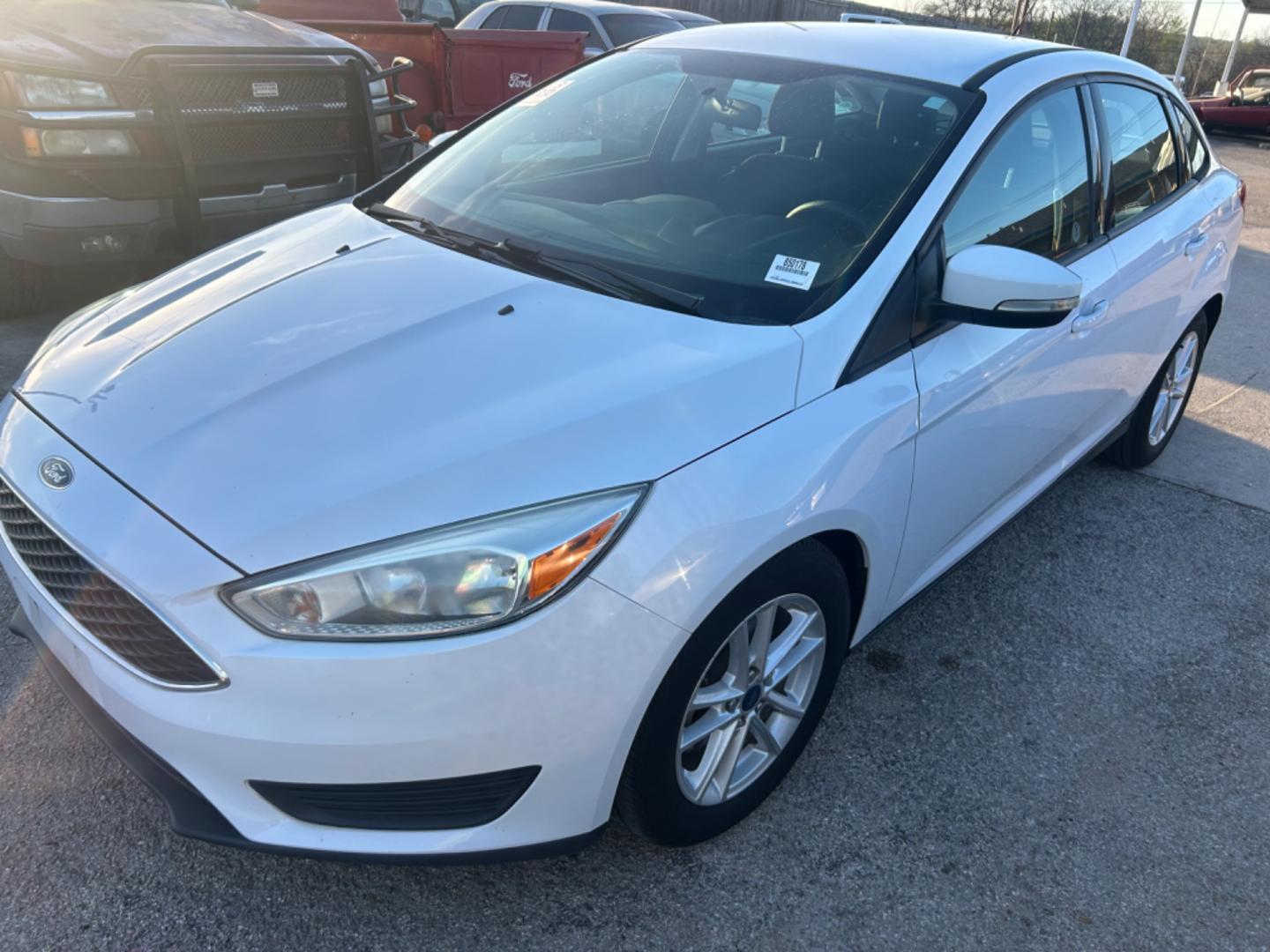 2016 White Ford Focus SE Sedan (1FADP3F28GL) with an 2.0L L4 DOHC 16V engine, located at 1687 Business 35 S, New Braunfels, TX, 78130, (830) 625-7159, 29.655487, -98.051491 - Photo#0